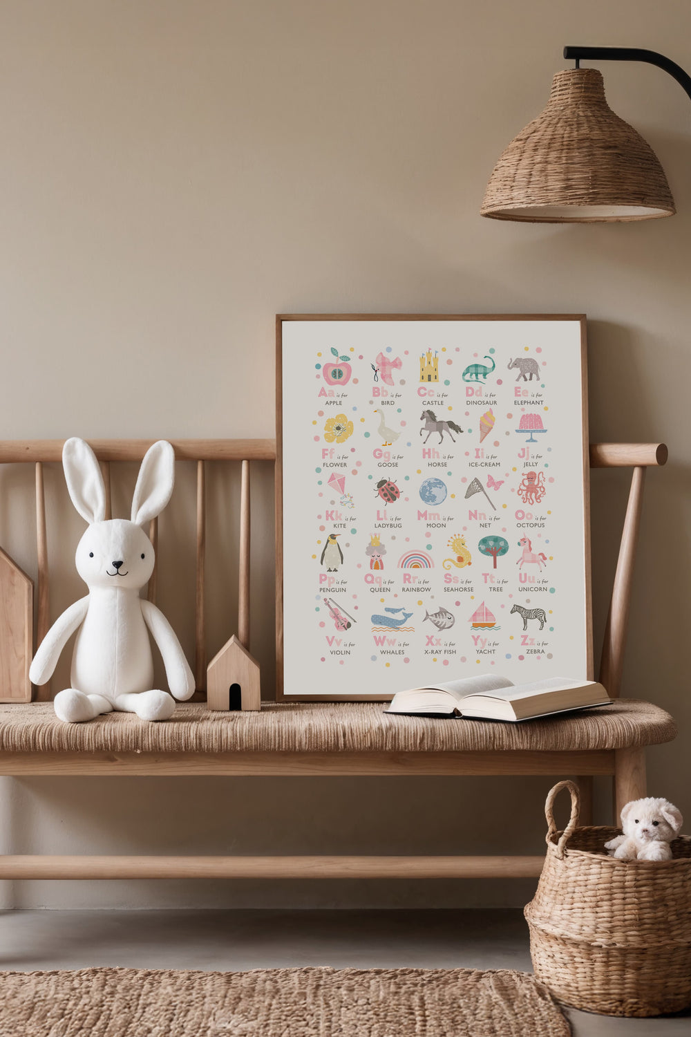 Pink alphabet nursery print displayed in a calm children’s room, educational wall art for baby and toddler bedrooms