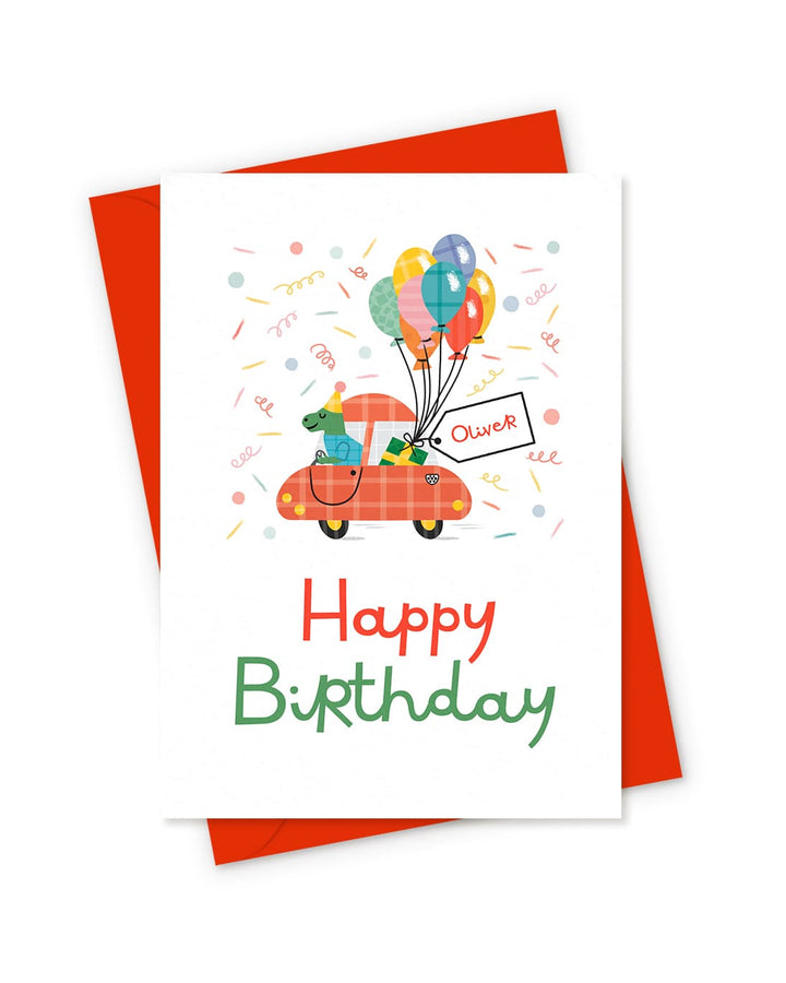 Birthday card with a dinosaur in a car and balloons design on a white background