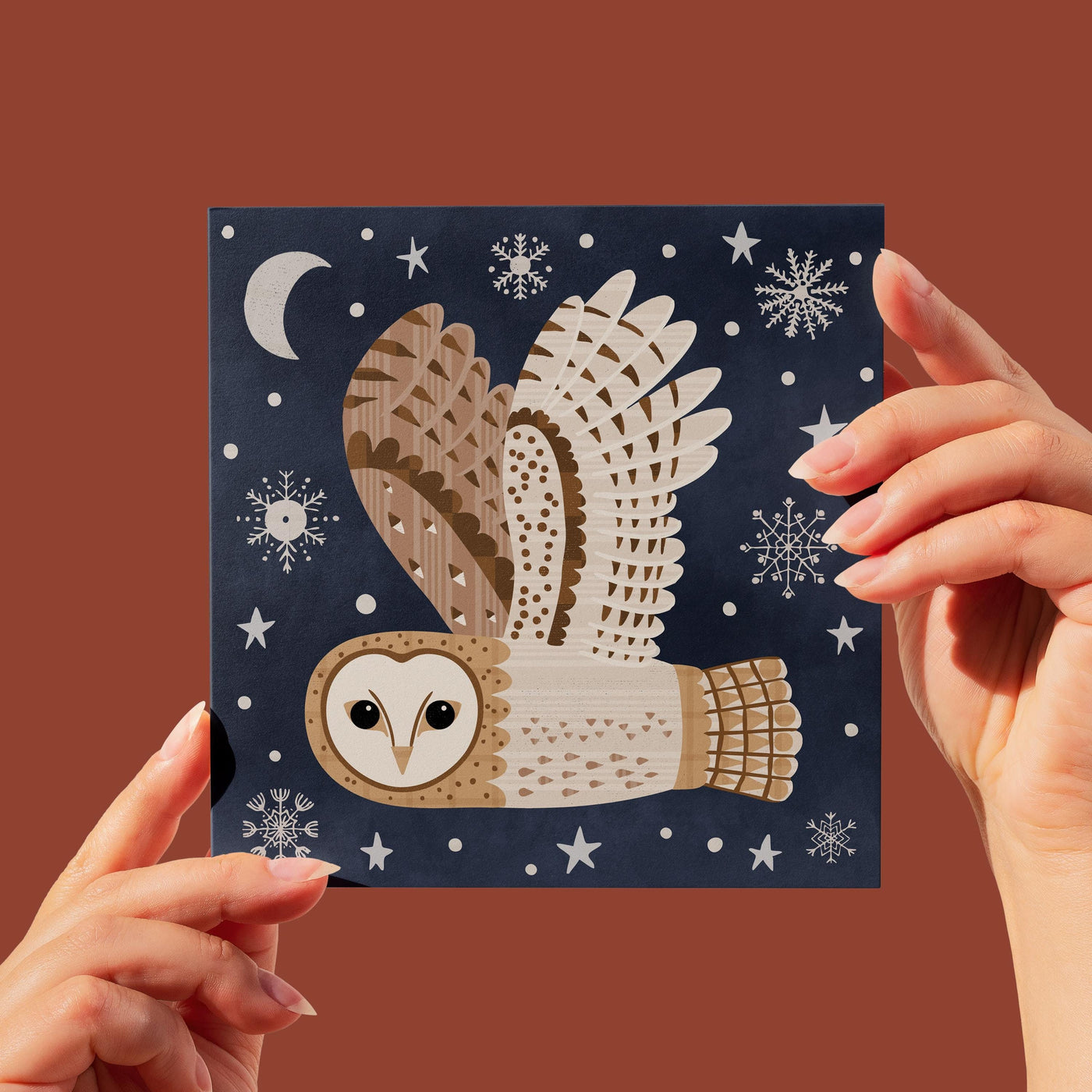 Modern Barn Owl Illustration on a christmas card- flying through a night sky with snowflakes, stars and moon.