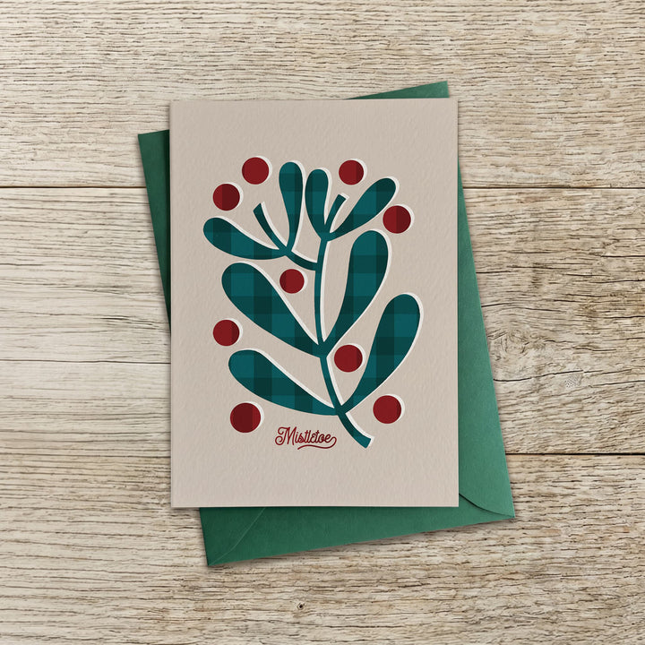 Contemporary mistletoe Christmas card with stylised mistletoe leaves and berries