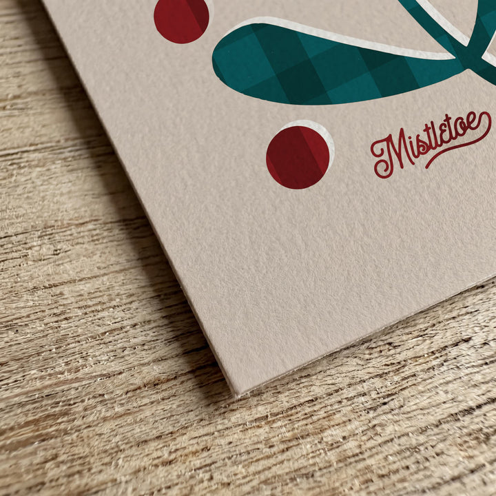 Close-up of the textured cream paper used for the botanical Christmas cards