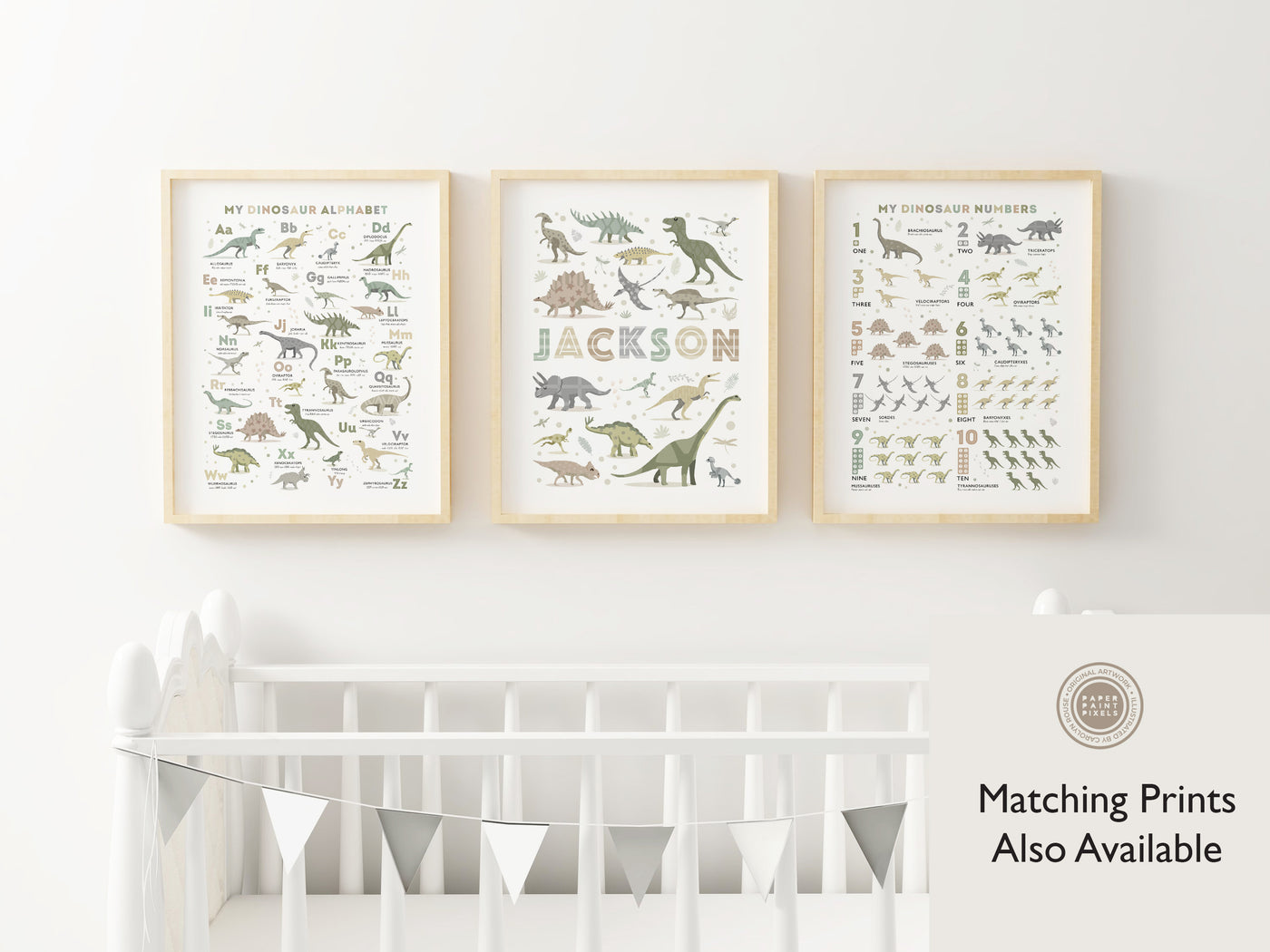 the Dinosaur Alphabet Poster in Earth Tone Colours framed and on the wall with two other prints, the dinosaur name print and the dinosaur counting print.