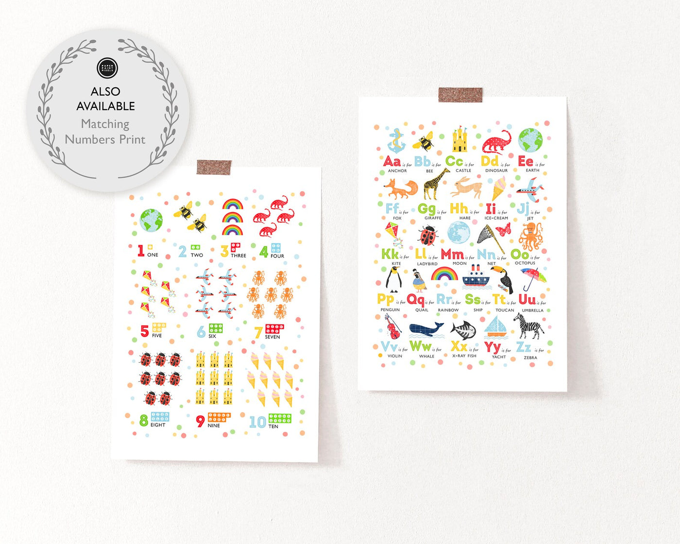 Two nursery art prints, one alphabet, one counting print held up by tape on a white wall