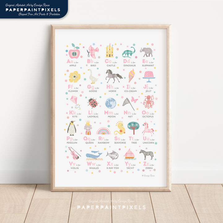A printable girls alphabet print with a pink theme, shown framed in a beautifully styled girl's bedroom to showcase nursery decor ideas.