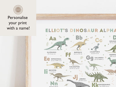A crop of The Dinosaur Alphabet Poster in Earth Tone Colours in an oak frame highlighting the ability to personalise the dino a-z