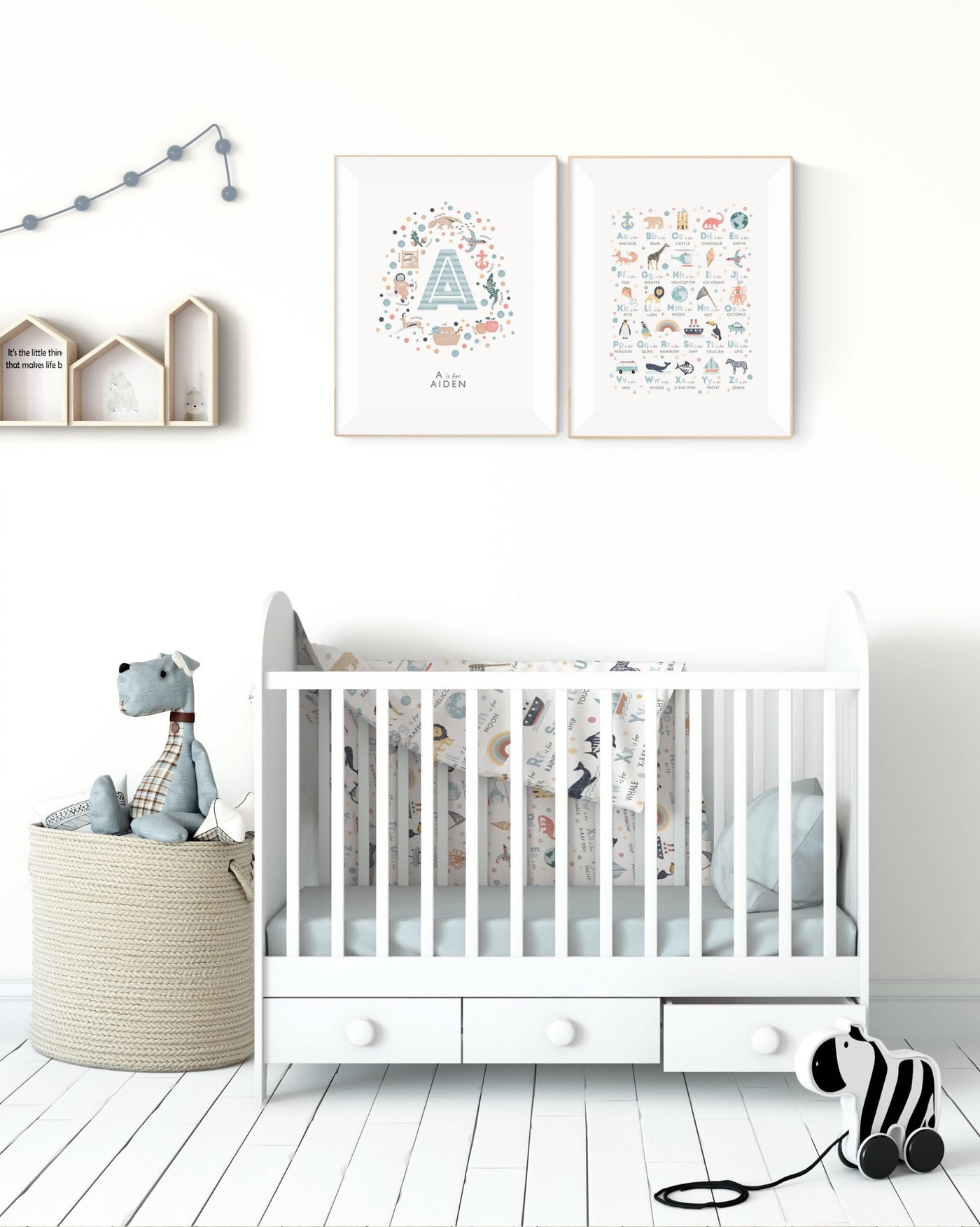 Personalised Boys Initial Letter Print - Letter A  and the boys alphabet nursery print framed and on the wall over a crib, with cream walls and toys in front